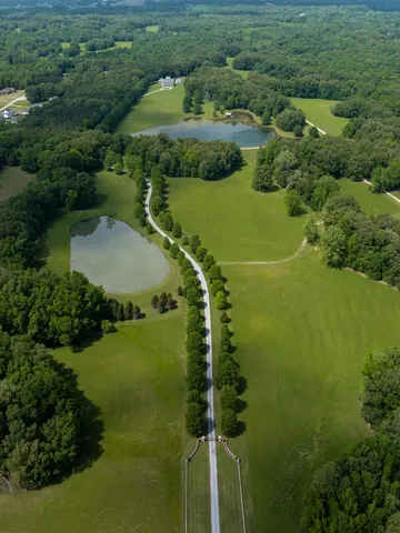a view of a lake with houses in the back
