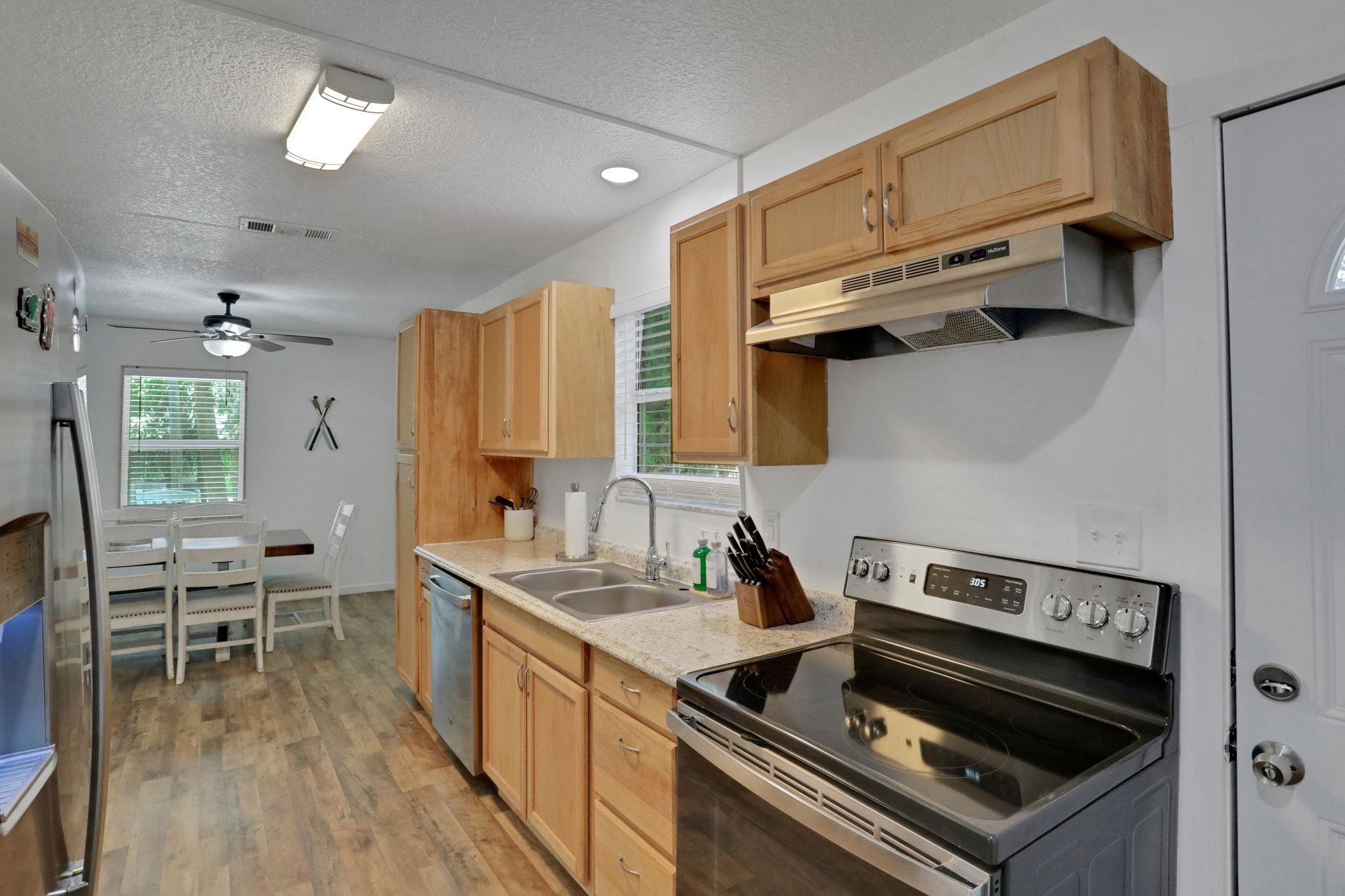 237 Riberia Street St. Augustine, FL 32084 - Photo 13 of 36 a kitchen with a stove and a sink