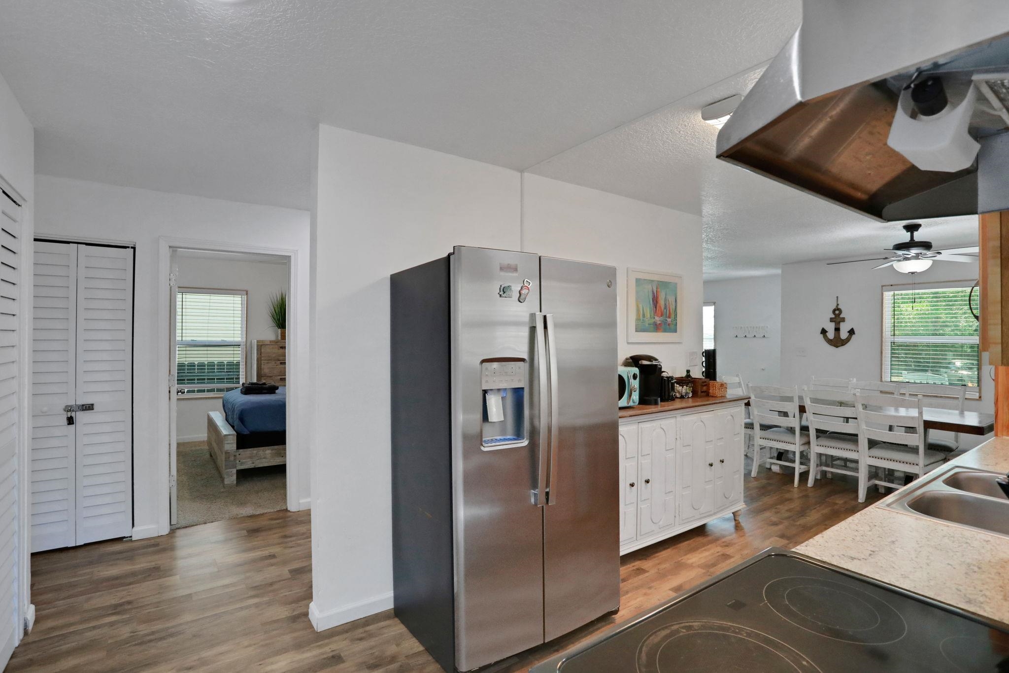 237 Riberia Street St. Augustine, FL 32084 - Photo 14 of 36 a kitchen with stainless steel appliances a refrigerator and wooden floor