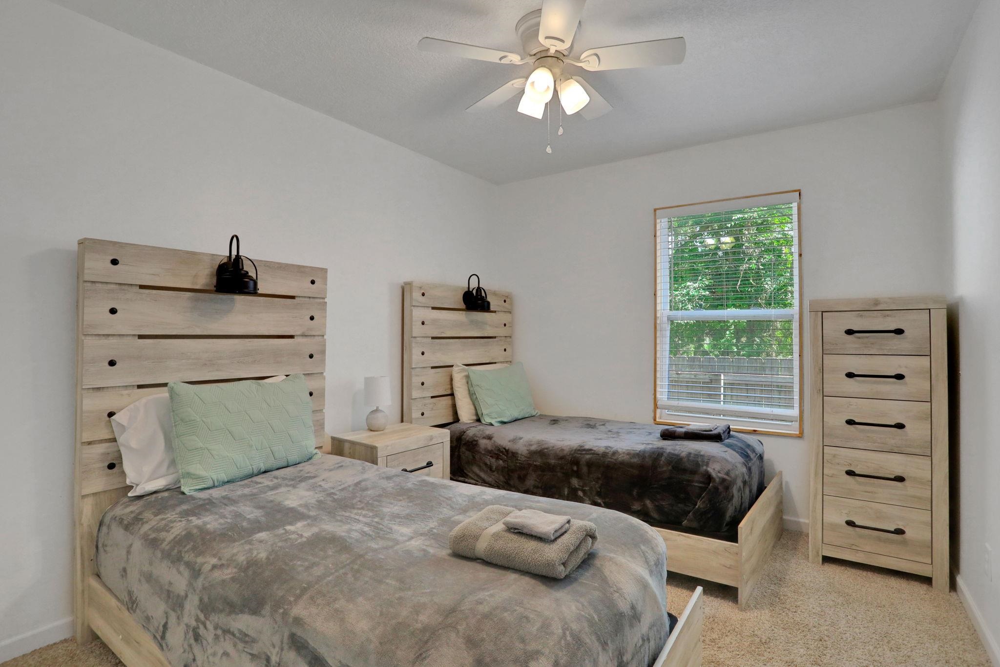 237 Riberia Street St. Augustine, FL 32084 - Photo 19 of 36 a bedroom with a bed and a window
