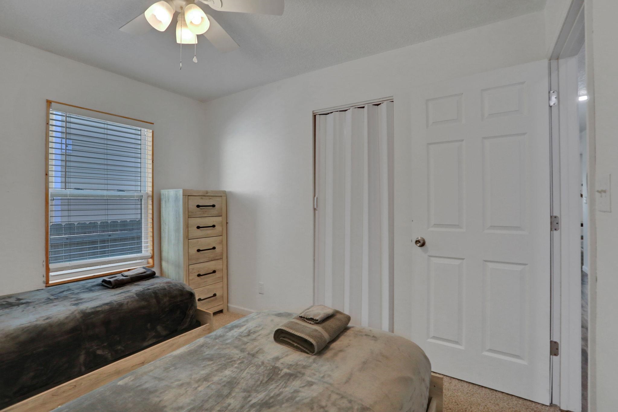 237 Riberia Street St. Augustine, FL 32084 - Photo 20 of 36 a bedroom with a bed and a chandelier