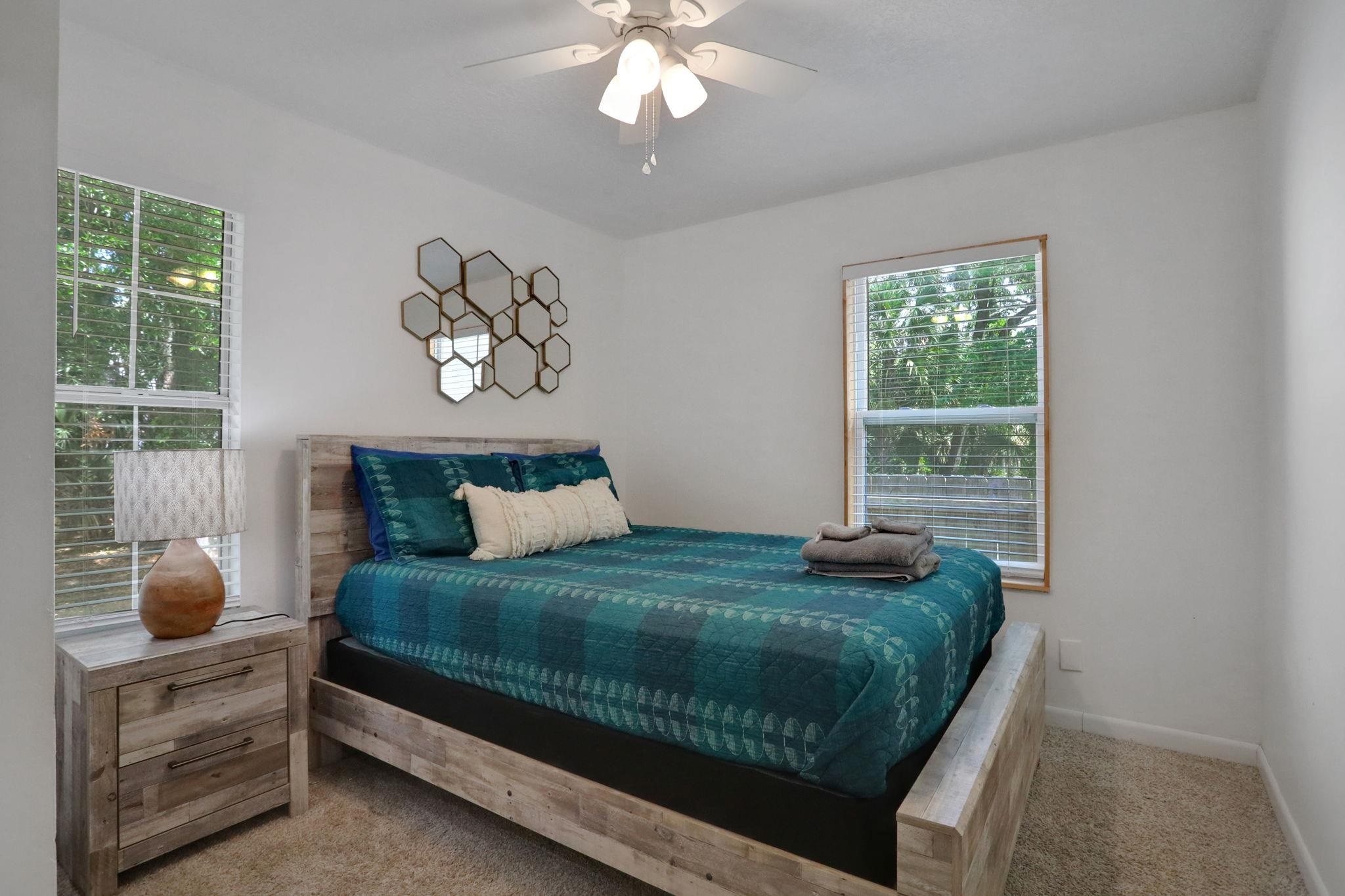 237 Riberia Street St. Augustine, FL 32084 - Photo 23 of 36 a bedroom with a bed and a window