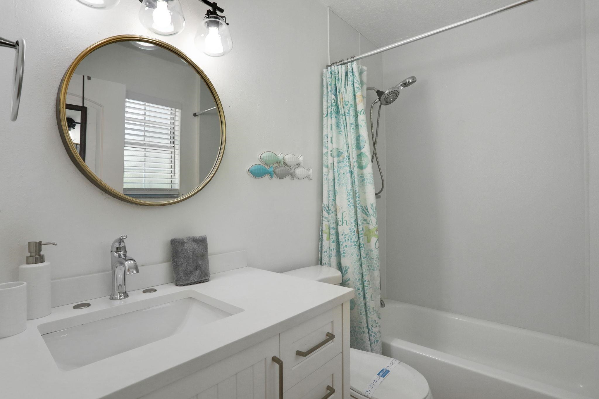 237 Riberia Street St. Augustine, FL 32084 - Photo 27 of 36 a bathroom with a sink a toilet and a mirror