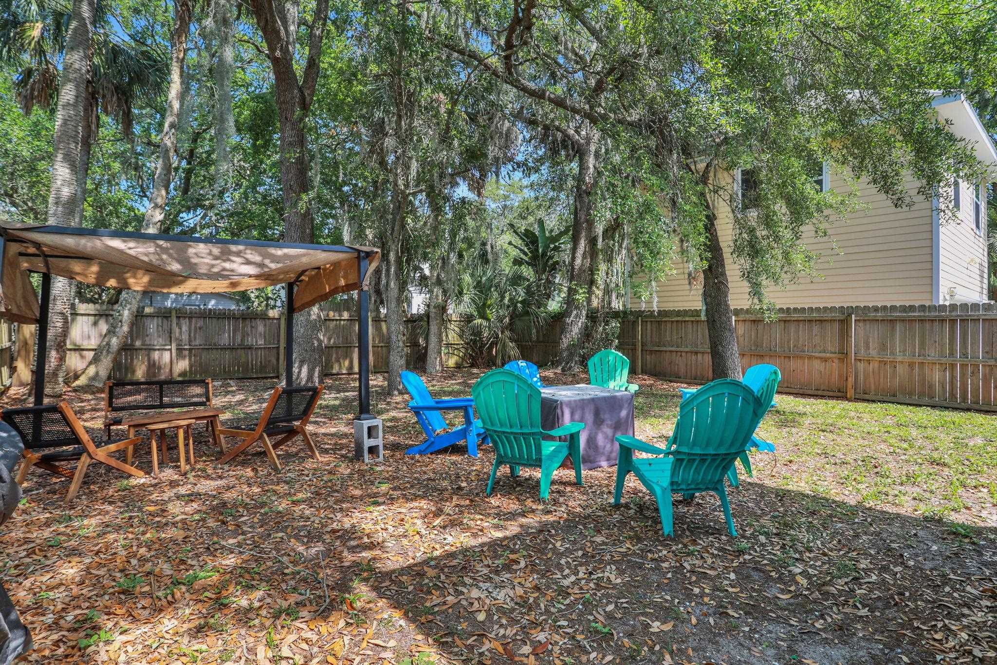 237 Riberia Street St. Augustine, FL 32084 - Photo 28 of 36 a view of a chairs and table in backyard