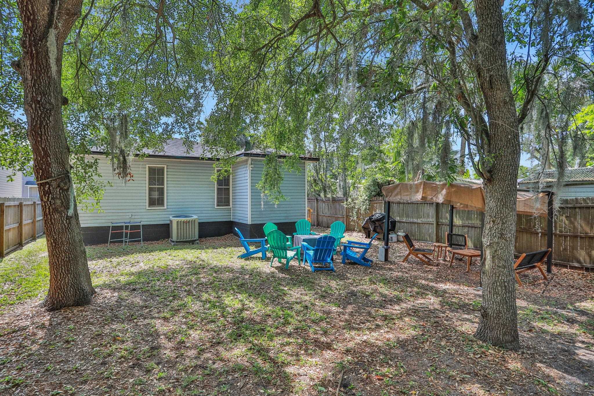 237 Riberia Street St. Augustine, FL 32084 - Photo 29 of 36 a view of a chairs and table in a backyard