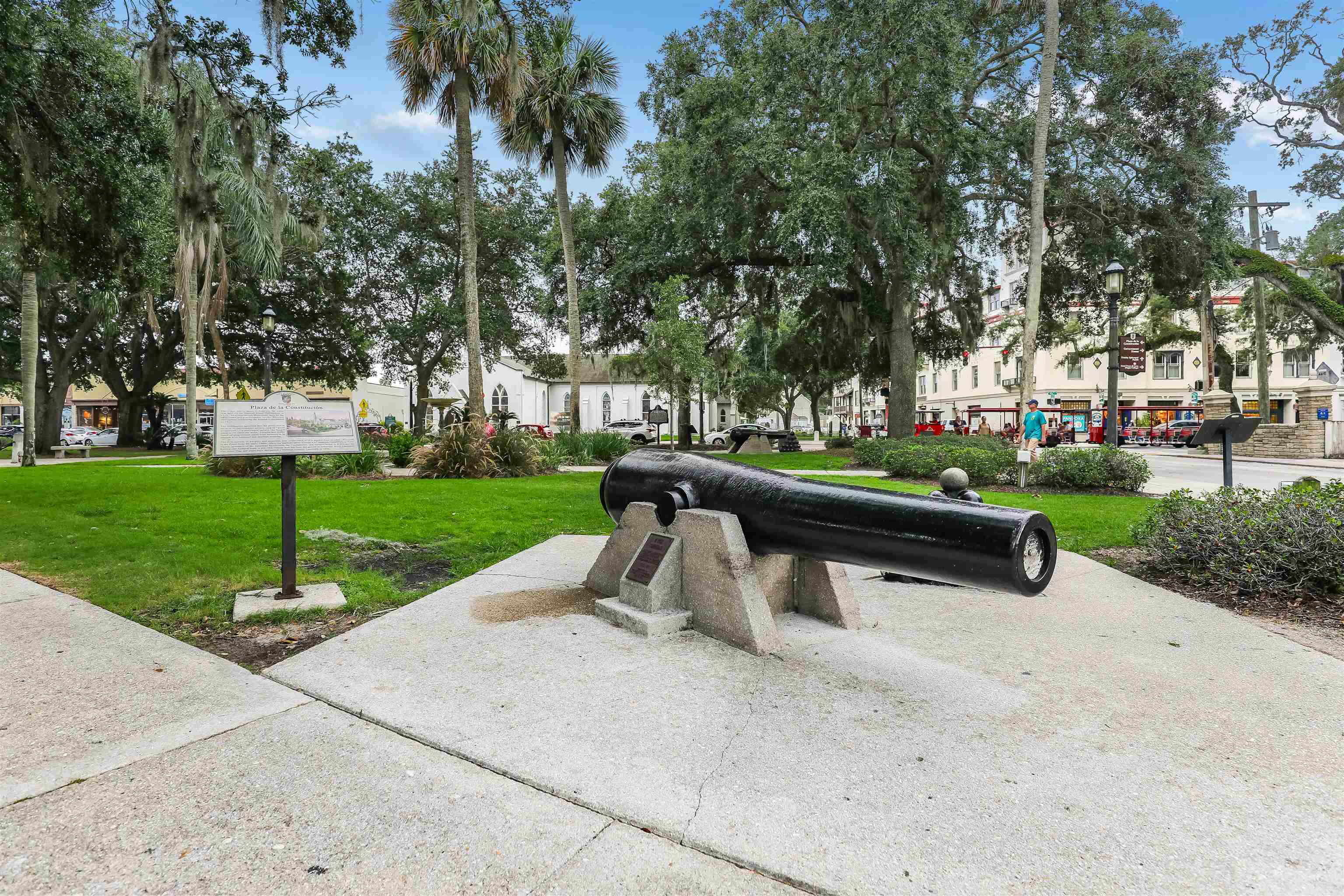 237 Riberia Street St. Augustine, FL 32084 - Photo 35 of 36 a park bench sitting in the middle of a park with large trees