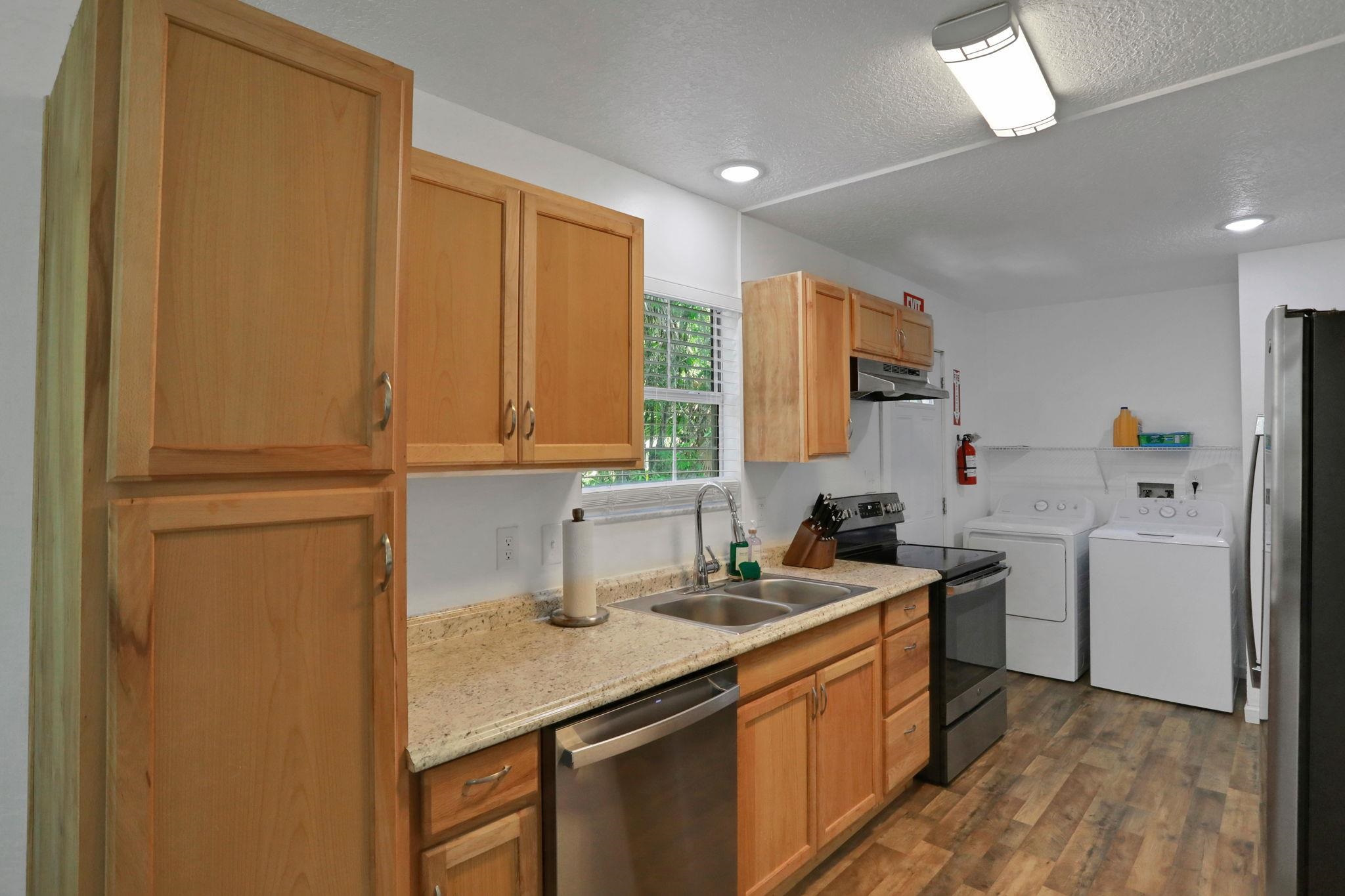 237 Riberia Street St. Augustine, FL 32084 - Photo 4 of 36 a kitchen with a sink stove and refrigerator