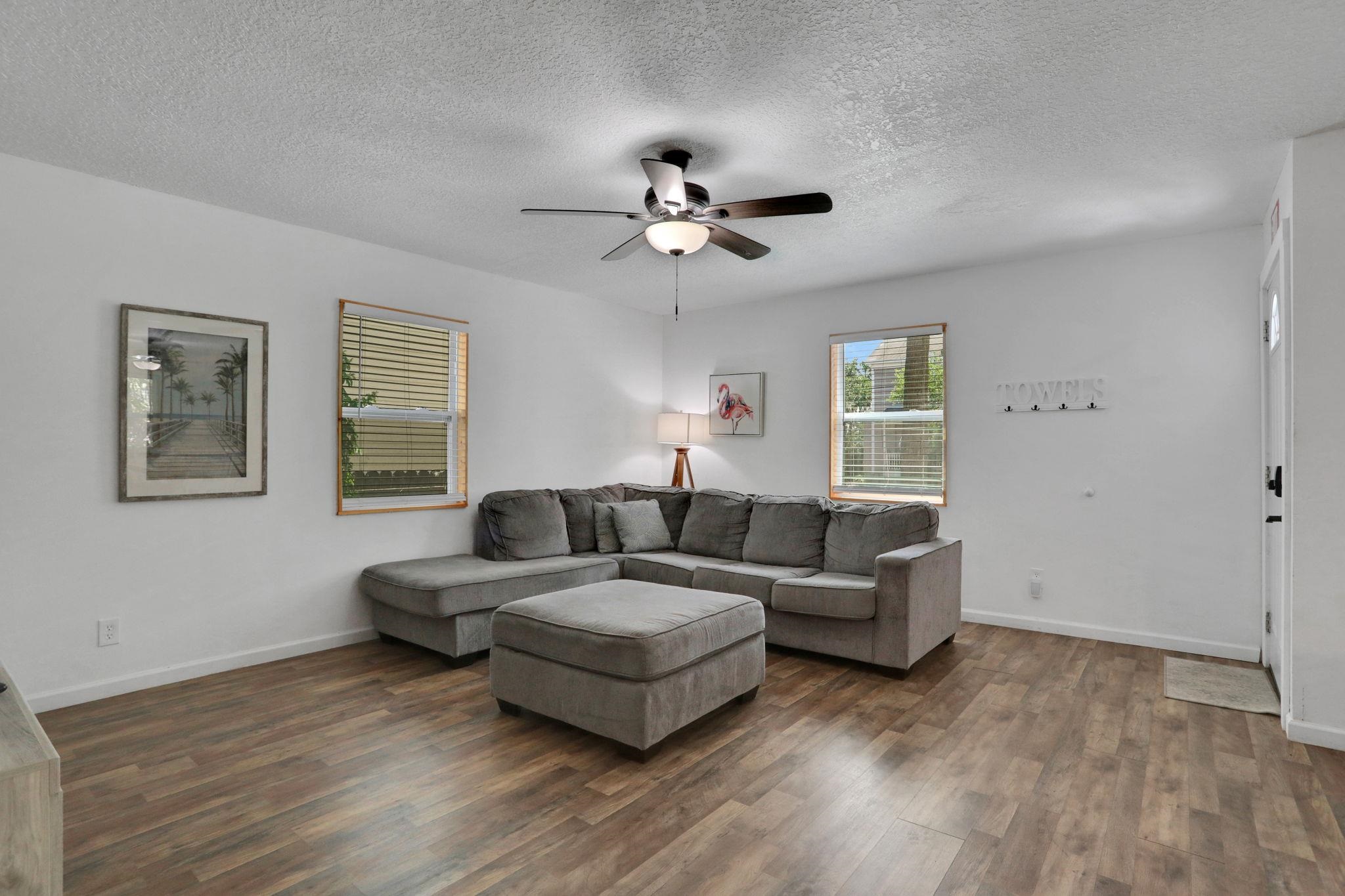 237 Riberia Street St. Augustine, FL 32084 - Photo 8 of 36 a living room with furniture and a ceiling fan