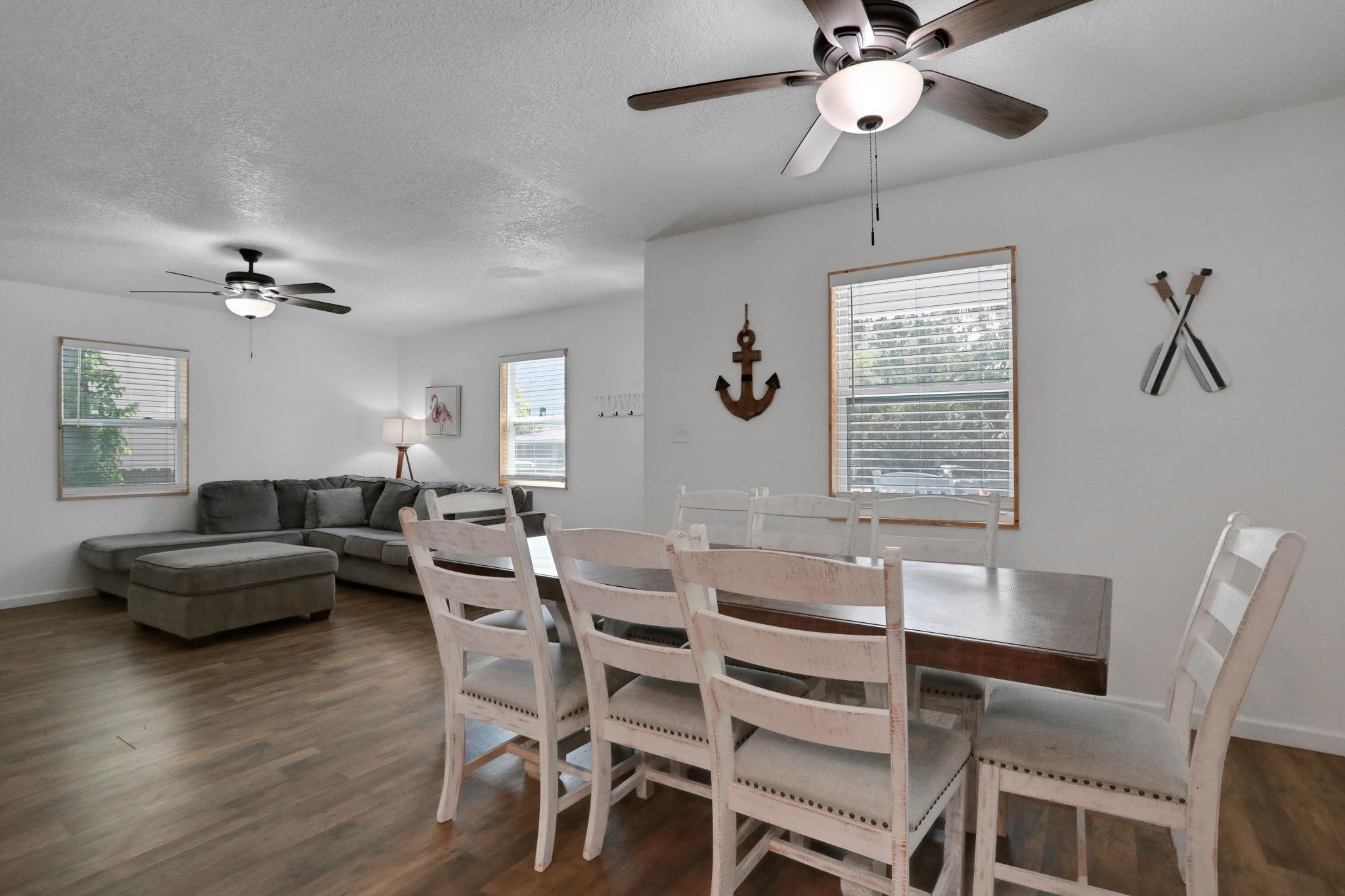 237 Riberia Street St. Augustine, FL 32084 - Photo 10 of 36 a living room with furniture a chandelier and a window