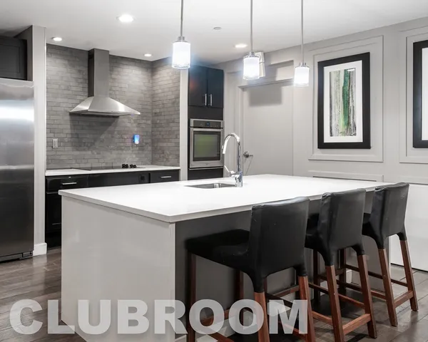 a kitchen with a sink and a refrigerator
