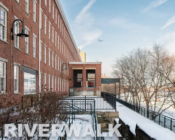 a front view of a house with large windows