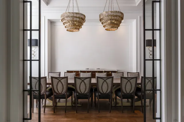 a view of a table and chairs in wooden floor