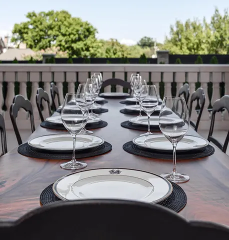 a kitchen with a table chairs and a stove