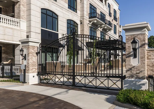 a view of a brick house with a street