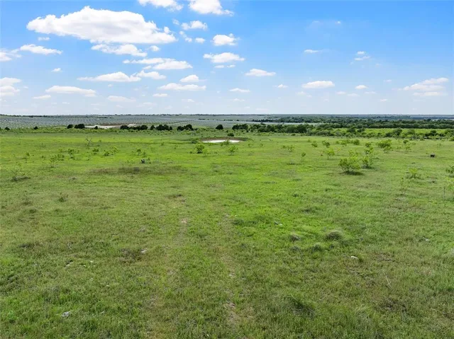 a view of a lake with houses in the back