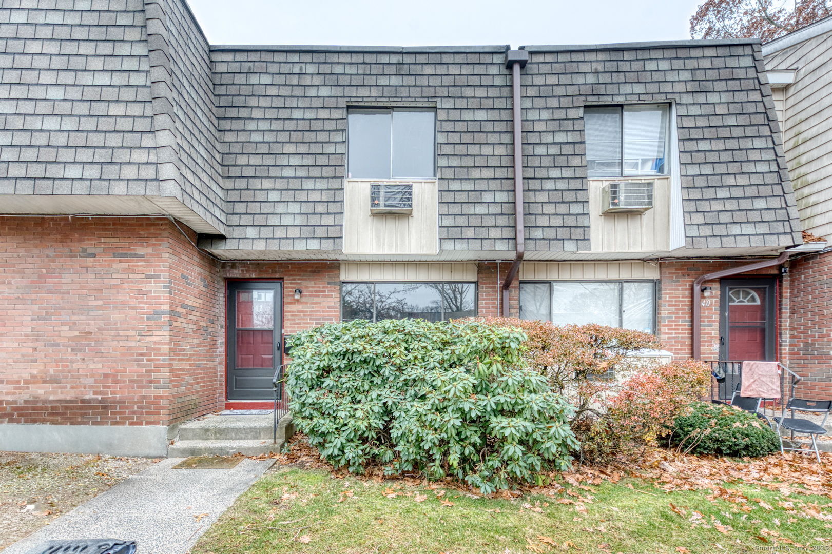 a front view of a house with garden