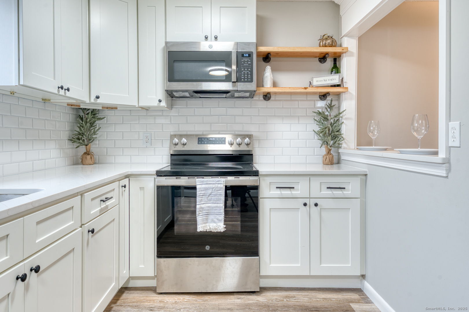 142 High Path Road, Unit 142 Windsor, CT 06095 - Photo 14 of 35 a kitchen with white cabinets stainless steel appliances and a sink