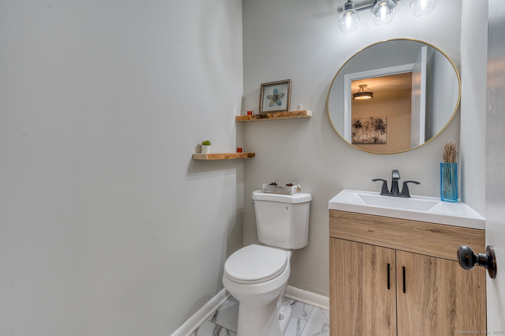 142 High Path Road, Unit 142 Windsor, CT 06095 - Photo 15 of 35 a bathroom with a toilet sink vanity and mirror