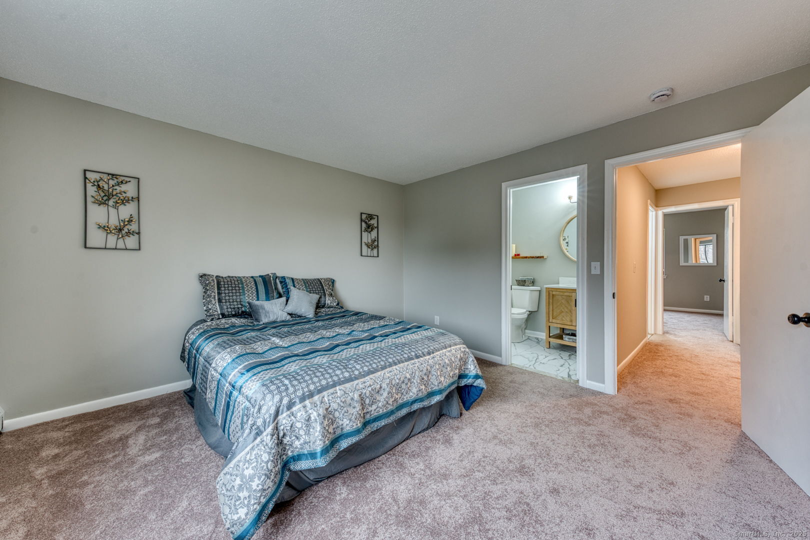 142 High Path Road, Unit 142 Windsor, CT 06095 - Photo 19 of 35 a spacious bedroom with a bed and a cabinets