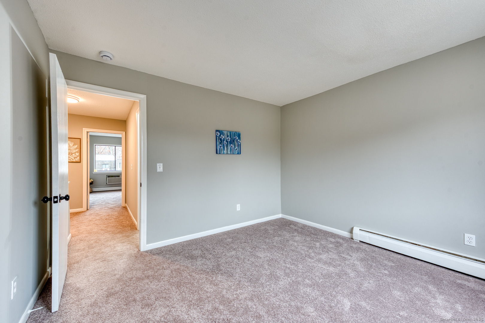 142 High Path Road, Unit 142 Windsor, CT 06095 - Photo 23 of 35 an empty room with mirror and a bench