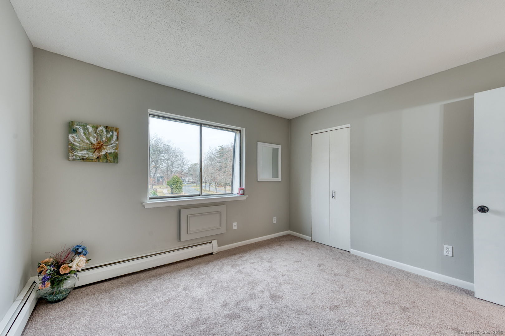 142 High Path Road, Unit 142 Windsor, CT 06095 - Photo 24 of 35 a view of an empty room with a window