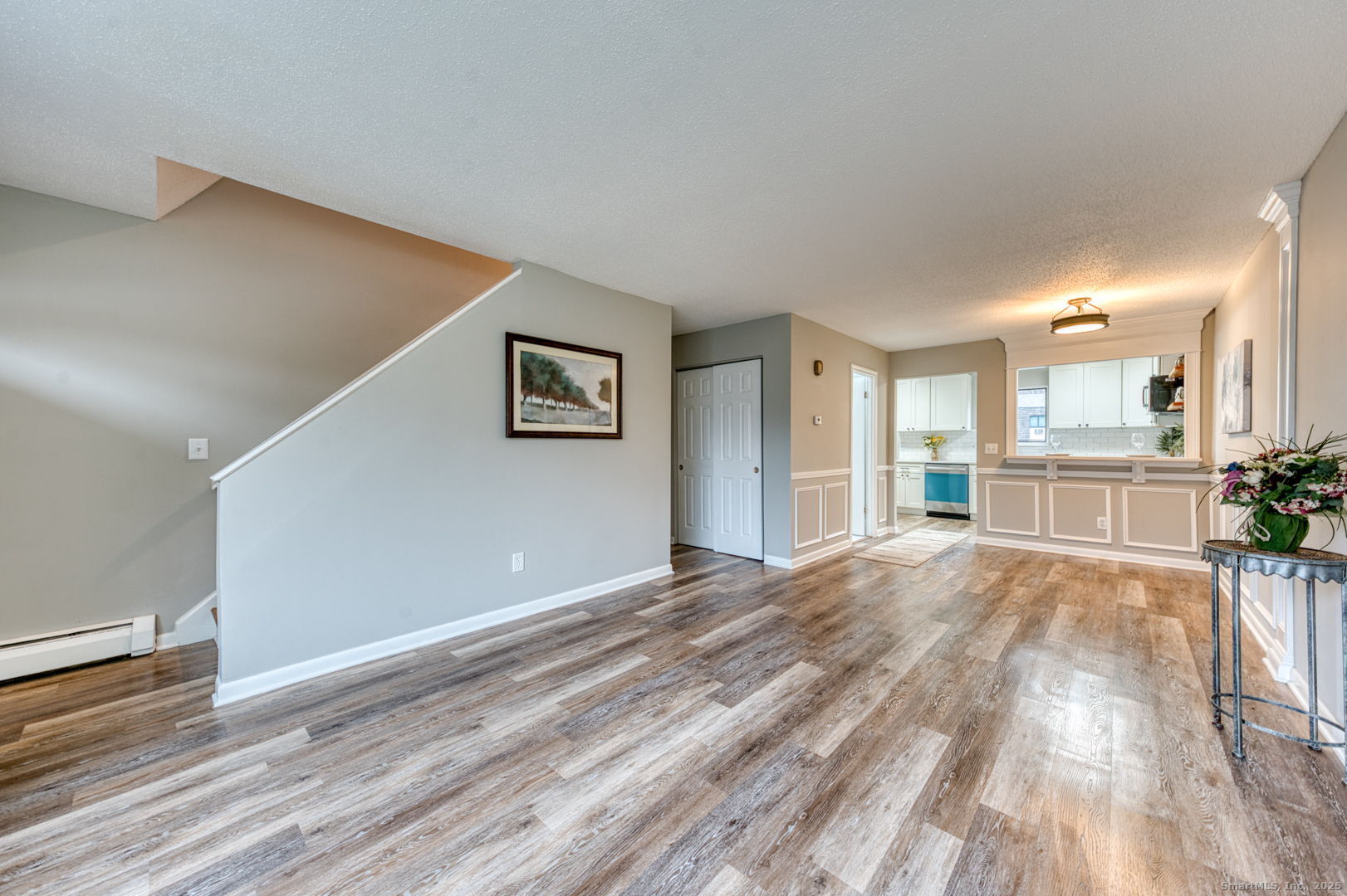 142 High Path Road, Unit 142 Windsor, CT 06095 - Photo 6 of 35 a view of an empty room with wooden floor and a window