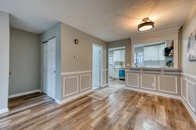 a room with a dresser and a wooden floor