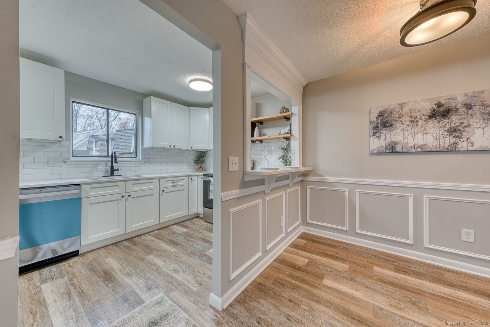 142 High Path Road, Unit 142 Windsor, CT 06095 - Photo 9 of 35 a kitchen with white cabinets and window