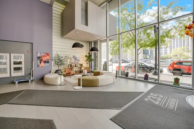 a view of living room with furniture and floor to ceiling window