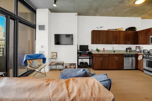 a bedroom with a bed and a television