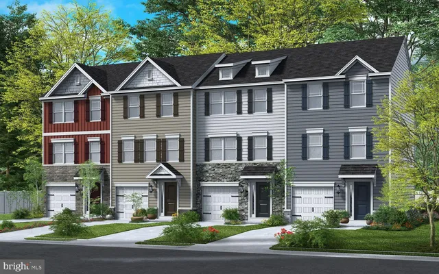 a view of multiple houses with a yard