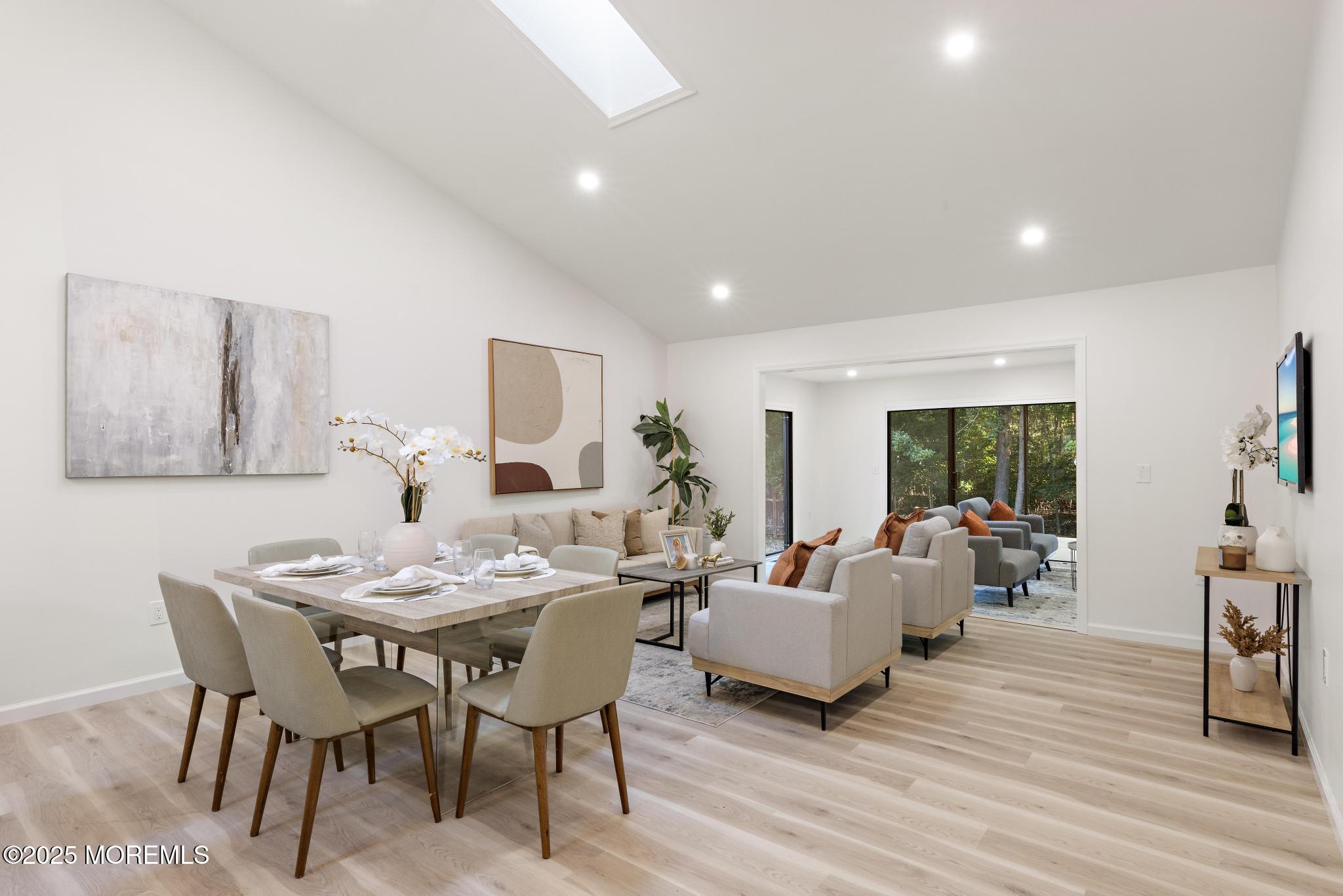 247 Jennings Road Manahawkin, NJ 08050 - Photo 13 of 35 a living room with furniture dining table and wooden floor