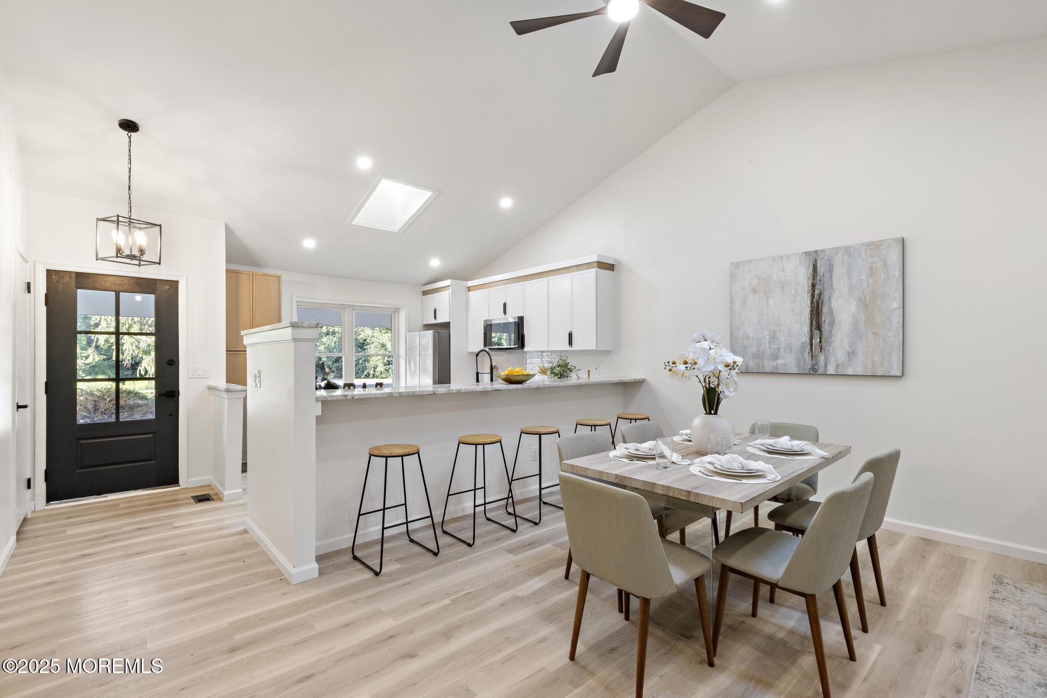 247 Jennings Road Manahawkin, NJ 08050 - Photo 14 of 35 a view of a dining room with furniture and wooden floor