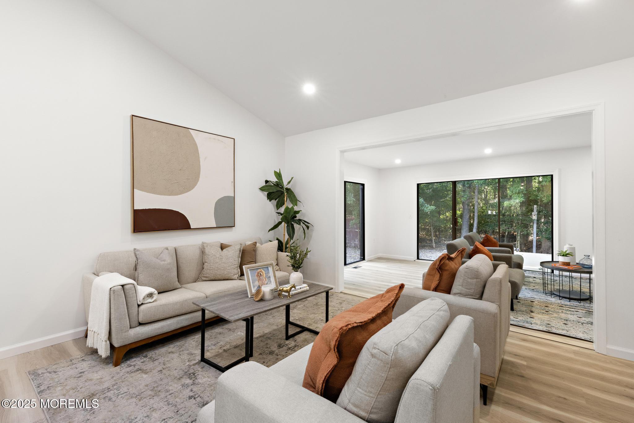 247 Jennings Road Manahawkin, NJ 08050 - Photo 18 of 35 a living room with furniture and a large window