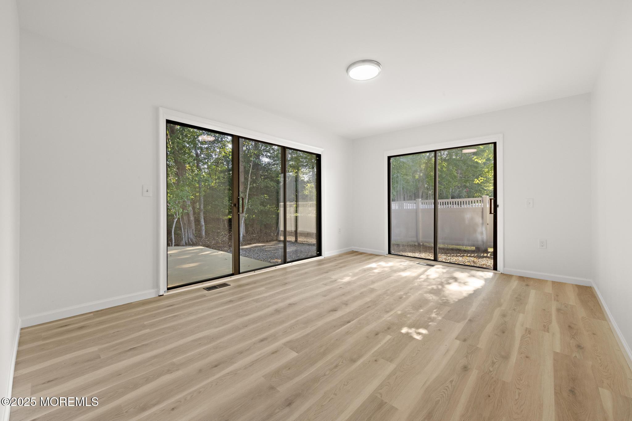 247 Jennings Road Manahawkin, NJ 08050 - Photo 28 of 35 a view of an empty room with glass door
