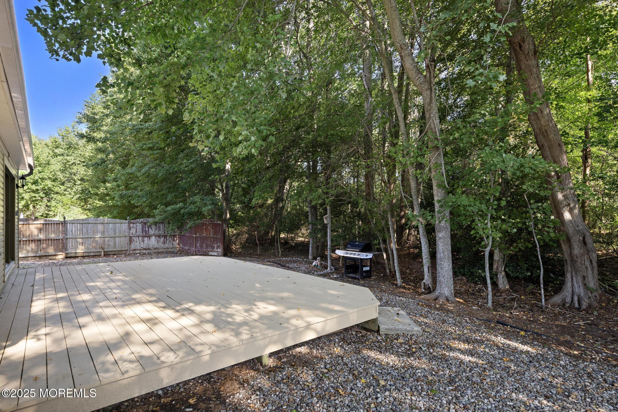 247 Jennings Road Manahawkin, NJ 08050 - Photo 31 of 35 a view of a backyard with large trees