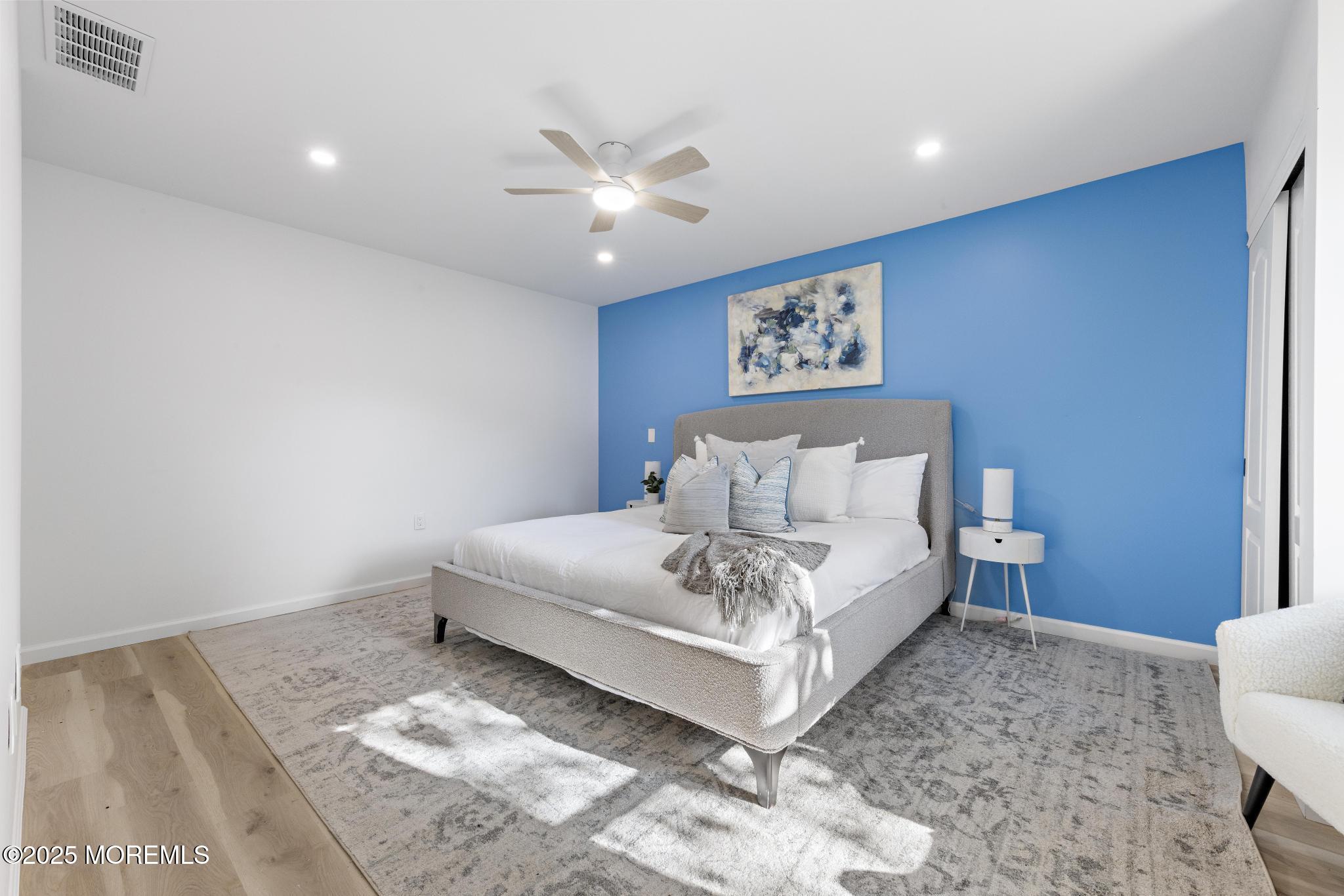 247 Jennings Road Manahawkin, NJ 08050 - Photo 10 of 16 a spacious bedroom with a bed and a window