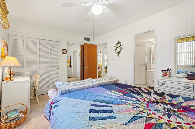 a bedroom with two beds and a window