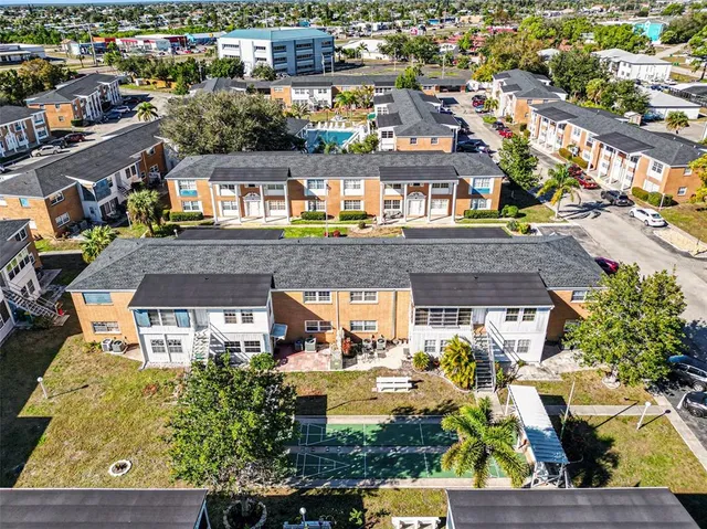 an aerial view of a house with a swimming pool