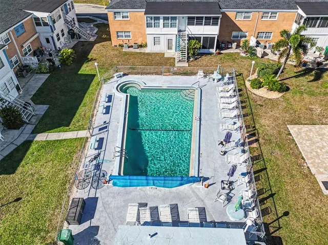 a view of a swimming pool with a lounge chairs