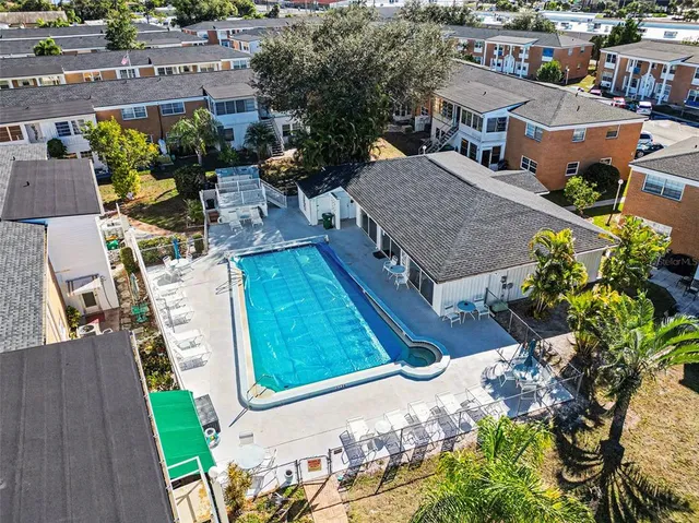 a view of a swimming pool with a lounge chairs