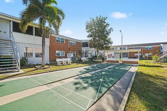 a swimming pool with outdoor seating and yard