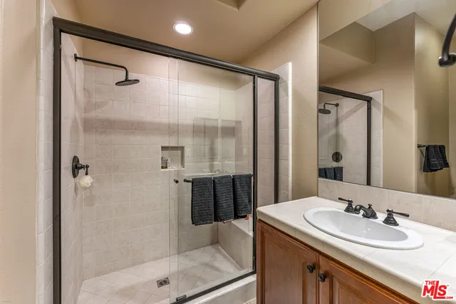 a view of a patio with table and chairs potted plants with wooden fence