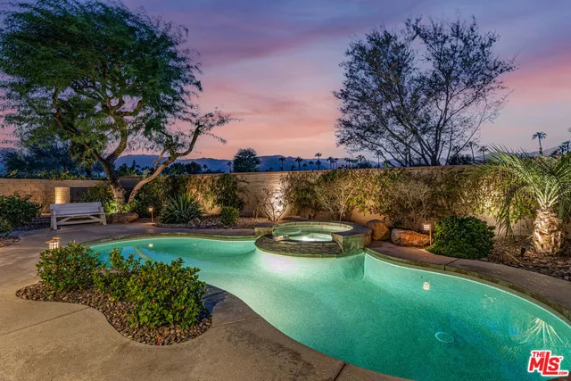 a front view of house with yard and trees