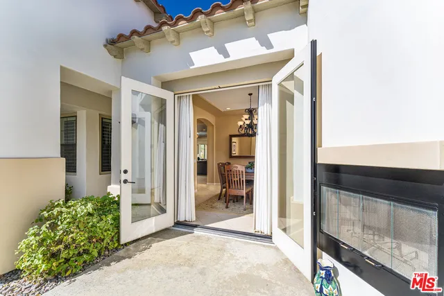 a view of a livingroom with workspace and a couch