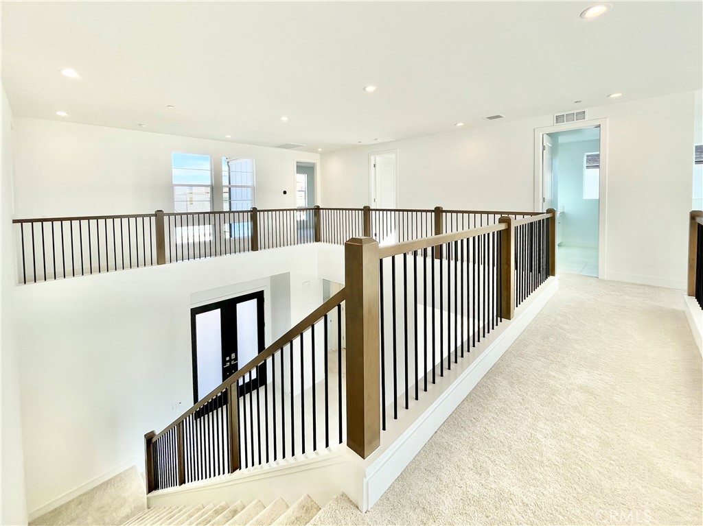 27557 Elderberry Drive Valencia, CA 91381 - Photo 15 of 39 a view of a hallway with a window