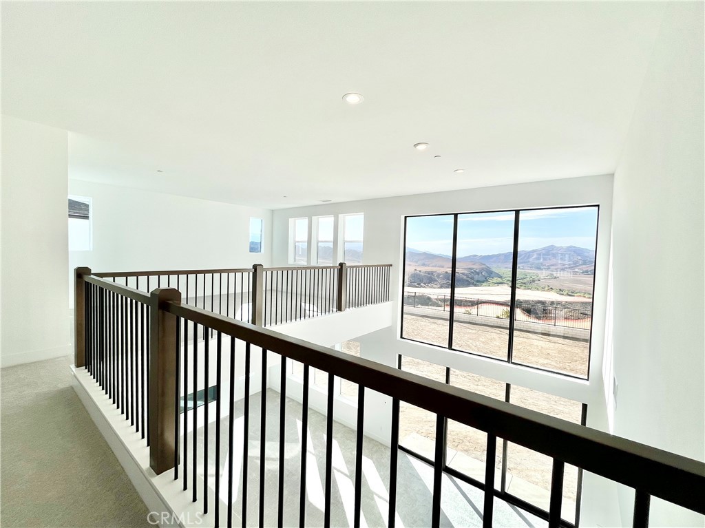 27557 Elderberry Drive Valencia, CA 91381 - Photo 16 of 39 a view of a porch with a floor to ceiling window
