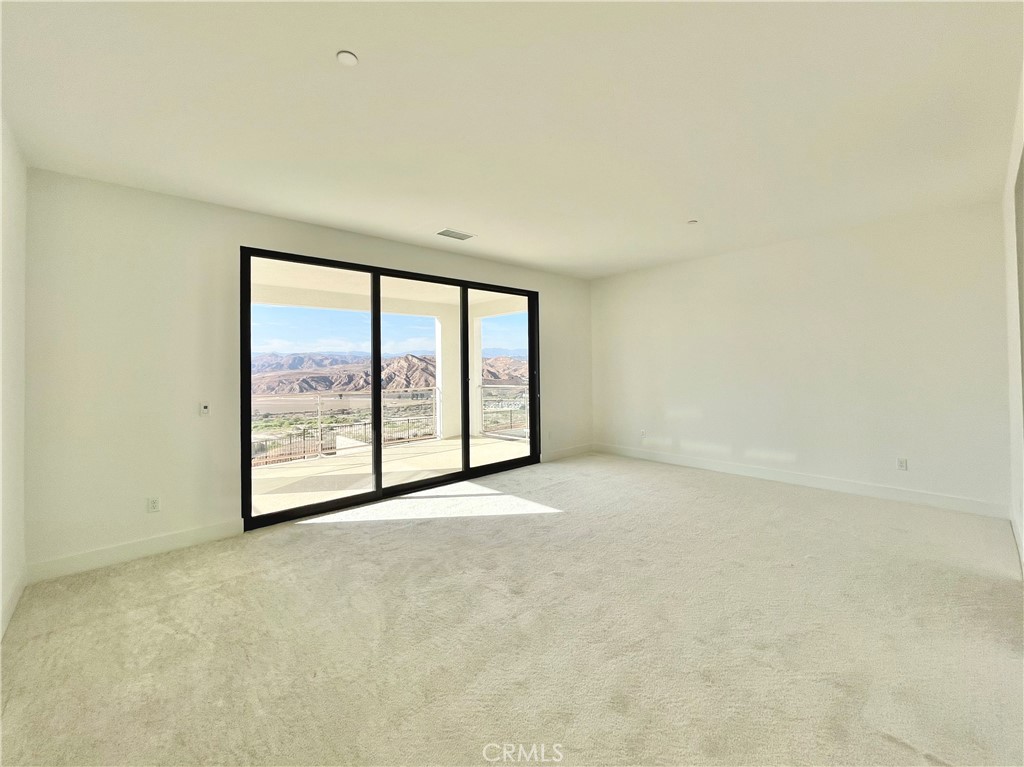 27557 Elderberry Drive Valencia, CA 91381 - Photo 20 of 39 an empty room with large windows