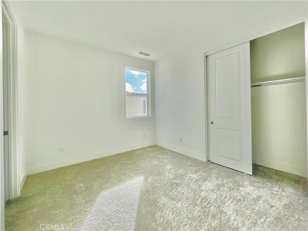 27557 Elderberry Drive Valencia, CA 91381 - Photo 25 of 39 a view of an empty room with a window