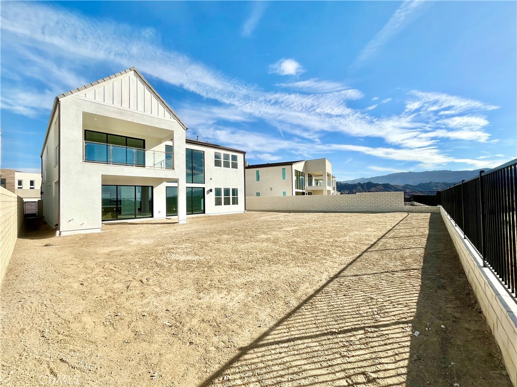 27557 Elderberry Drive Valencia, CA 91381 - Photo 32 of 39 a front view of a house with a yard